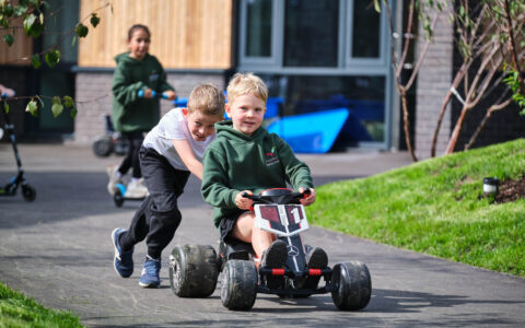 Boy on a bike. Boy pushing a bike.